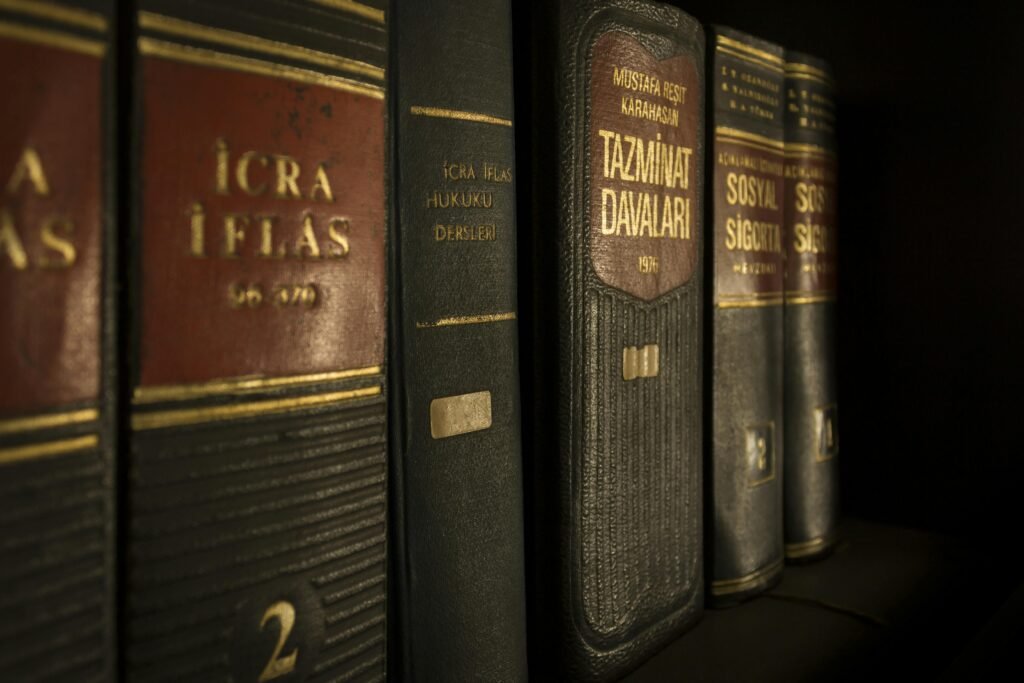 Legal books neatly arranged on a shelf, representing the laws and regulations